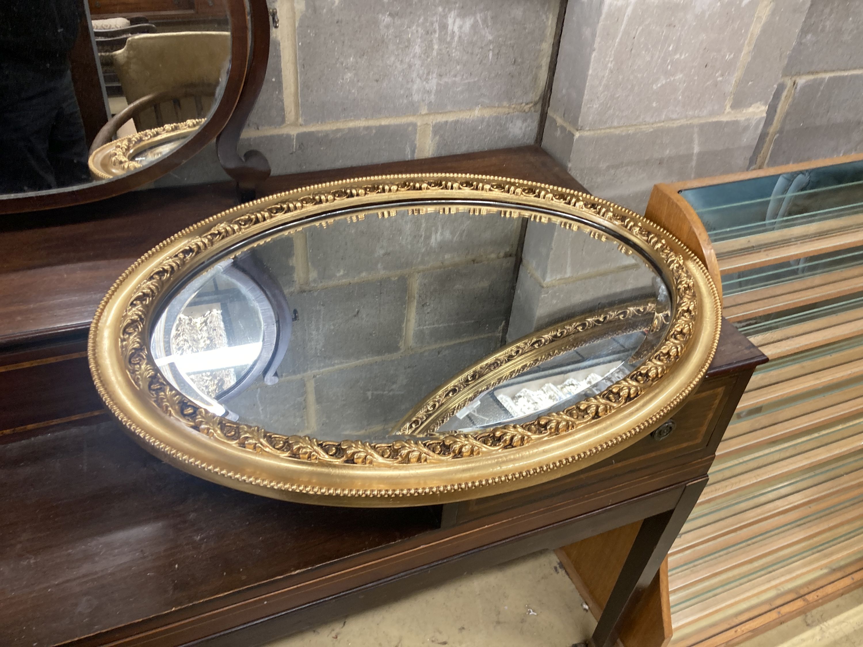 Two Victorian style oval gilt frame wall mirrors, larger 114cm, height 74cm